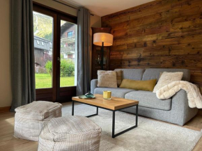 Appartement style chalet avec grande terrasse et parking prive